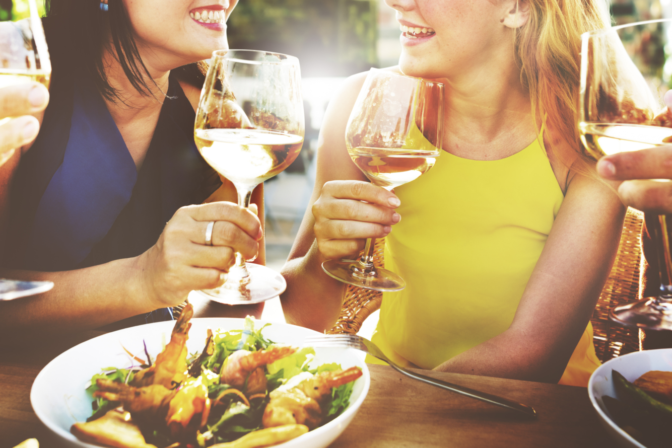 Friends enjoying wine and food